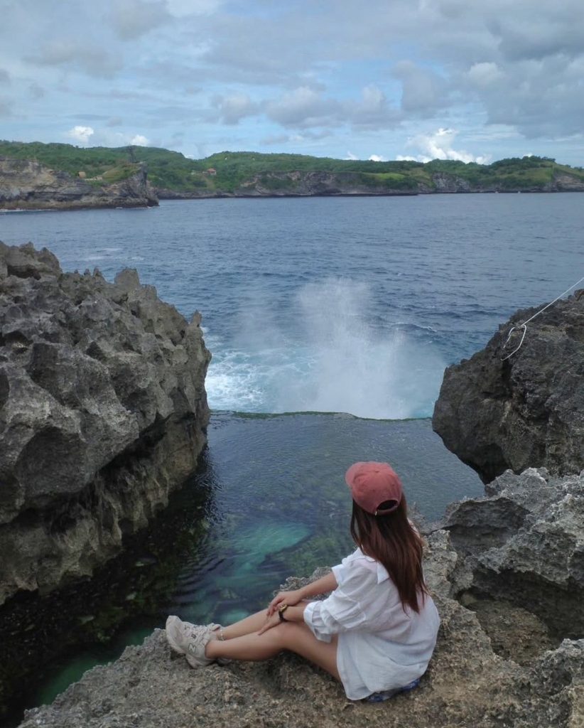 Angel's Billabong Nusa Penida with a natural pool of clear water between the coral cliffs.